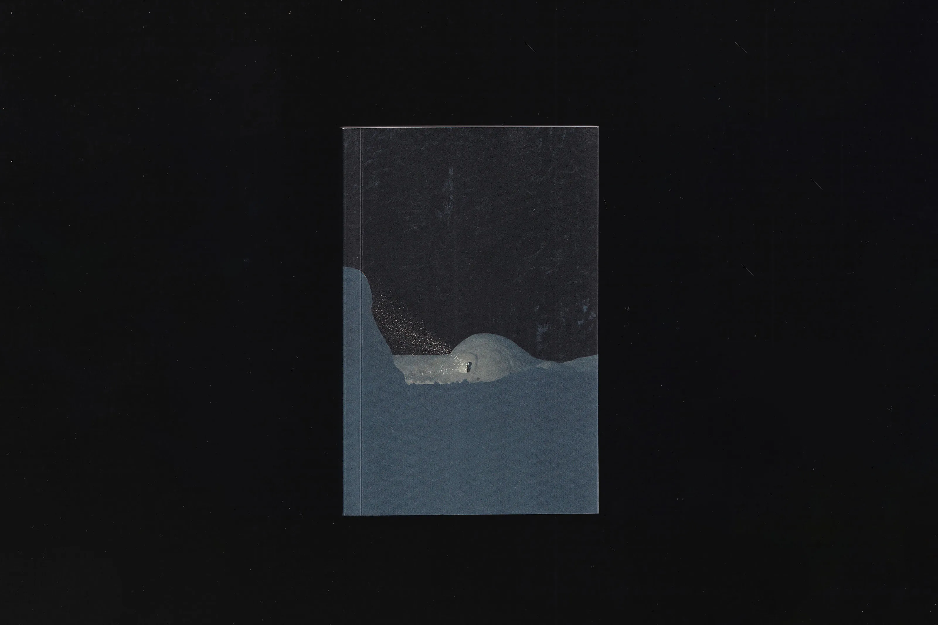 Book cover with a photo of a lit igloo in a dark, snowy landscape
