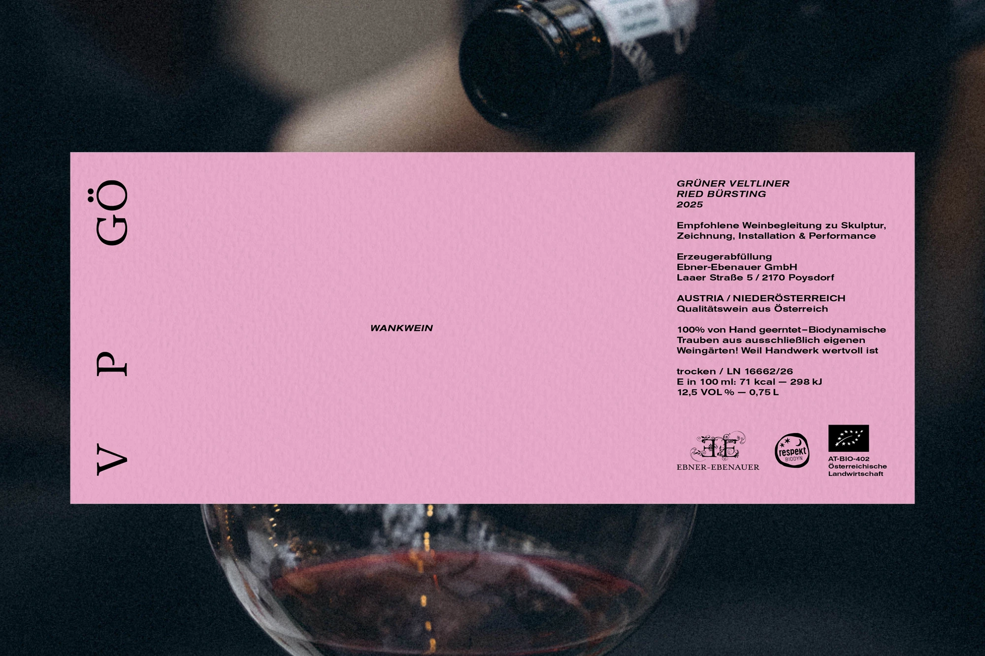 Pink Wankwein label lying on a photo of a wine glass