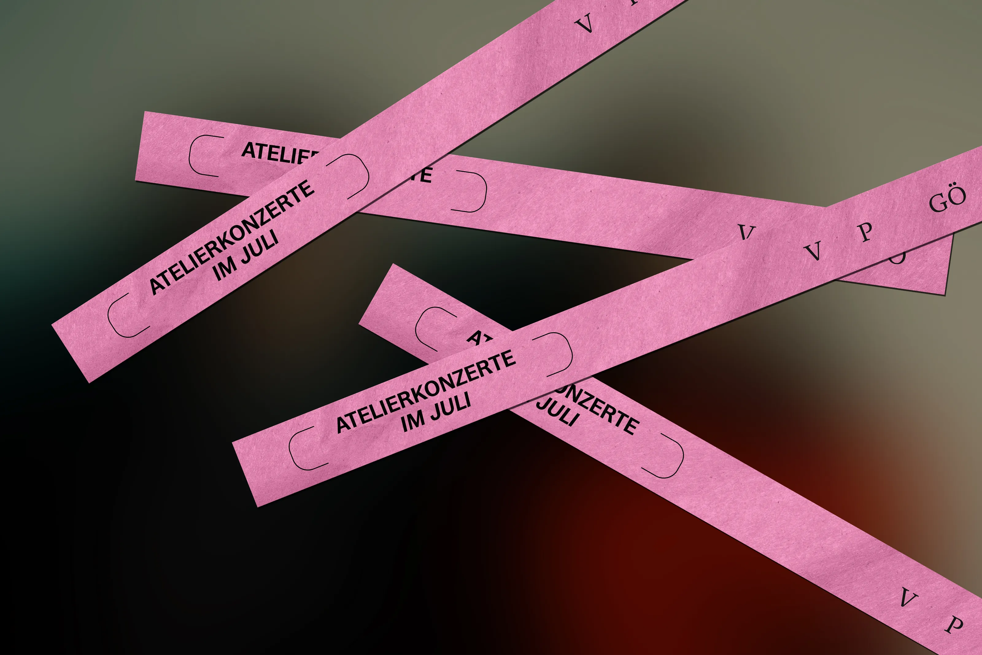 Pink entry wristbands printed with "Atelierkonzerte im Juli", scattered over a dark background