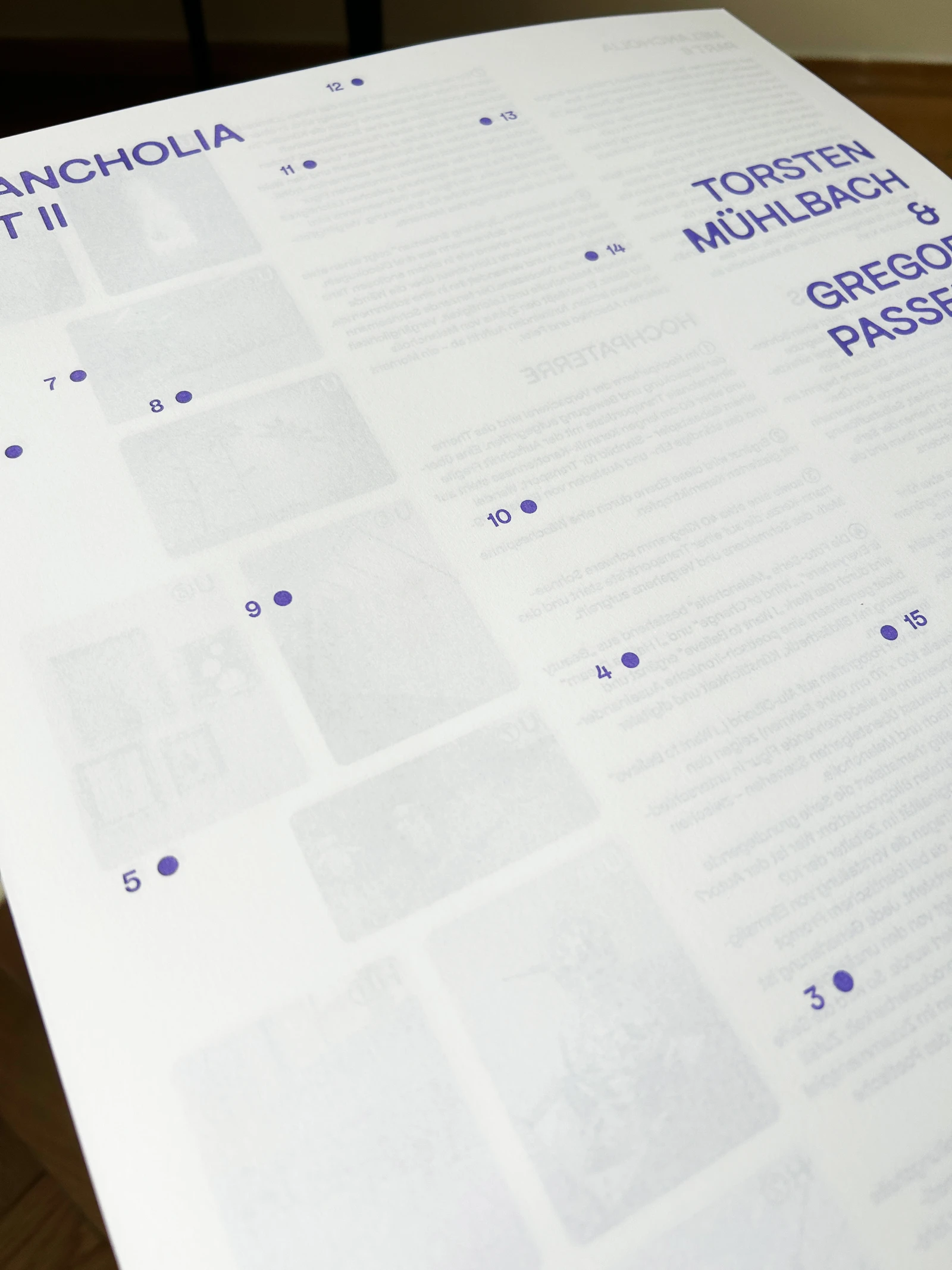 Close-up of a sheet with numbered dots and the artists' names