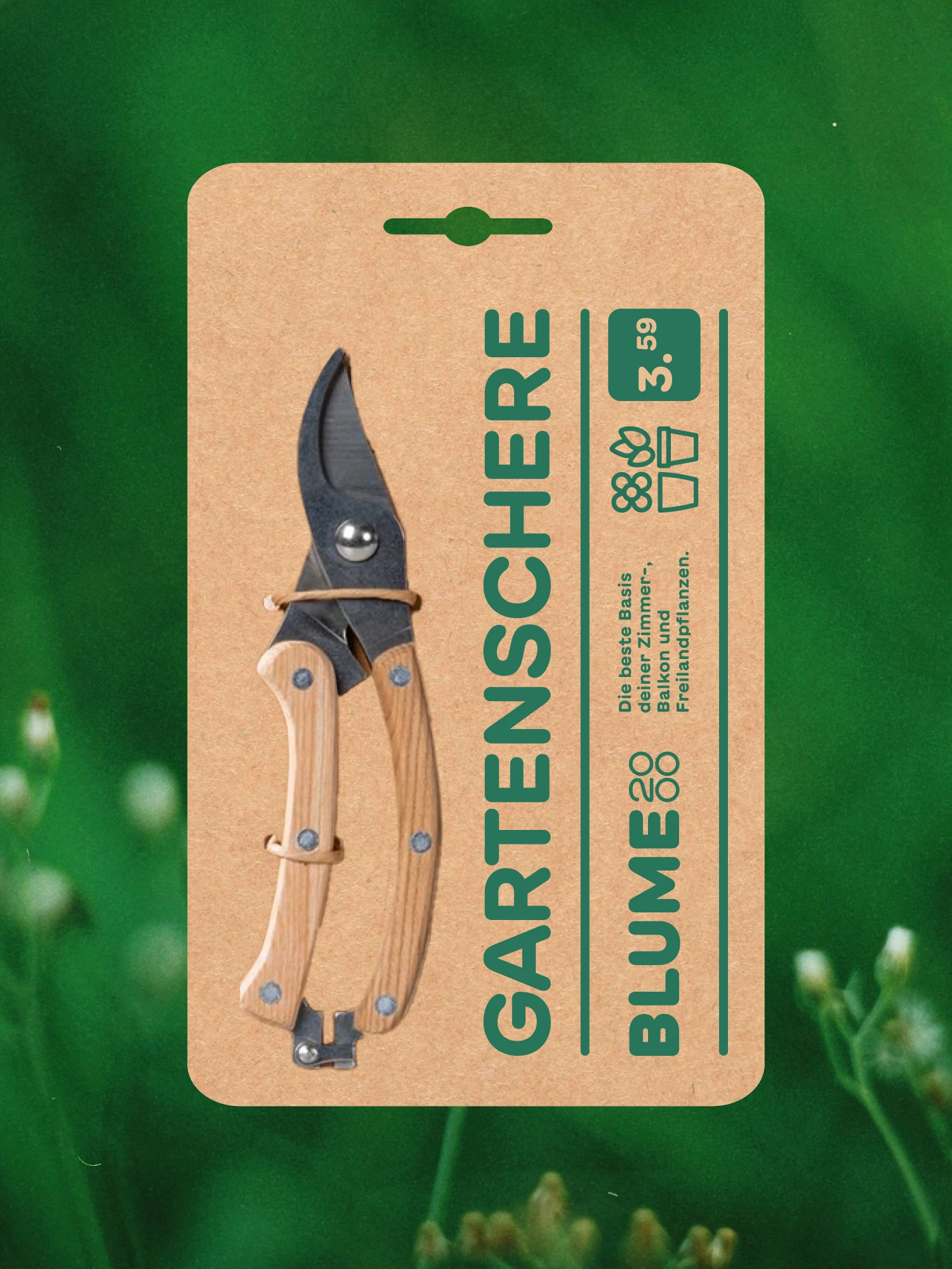Garden shears in Blume2000 cardboard packaging against green leaves
