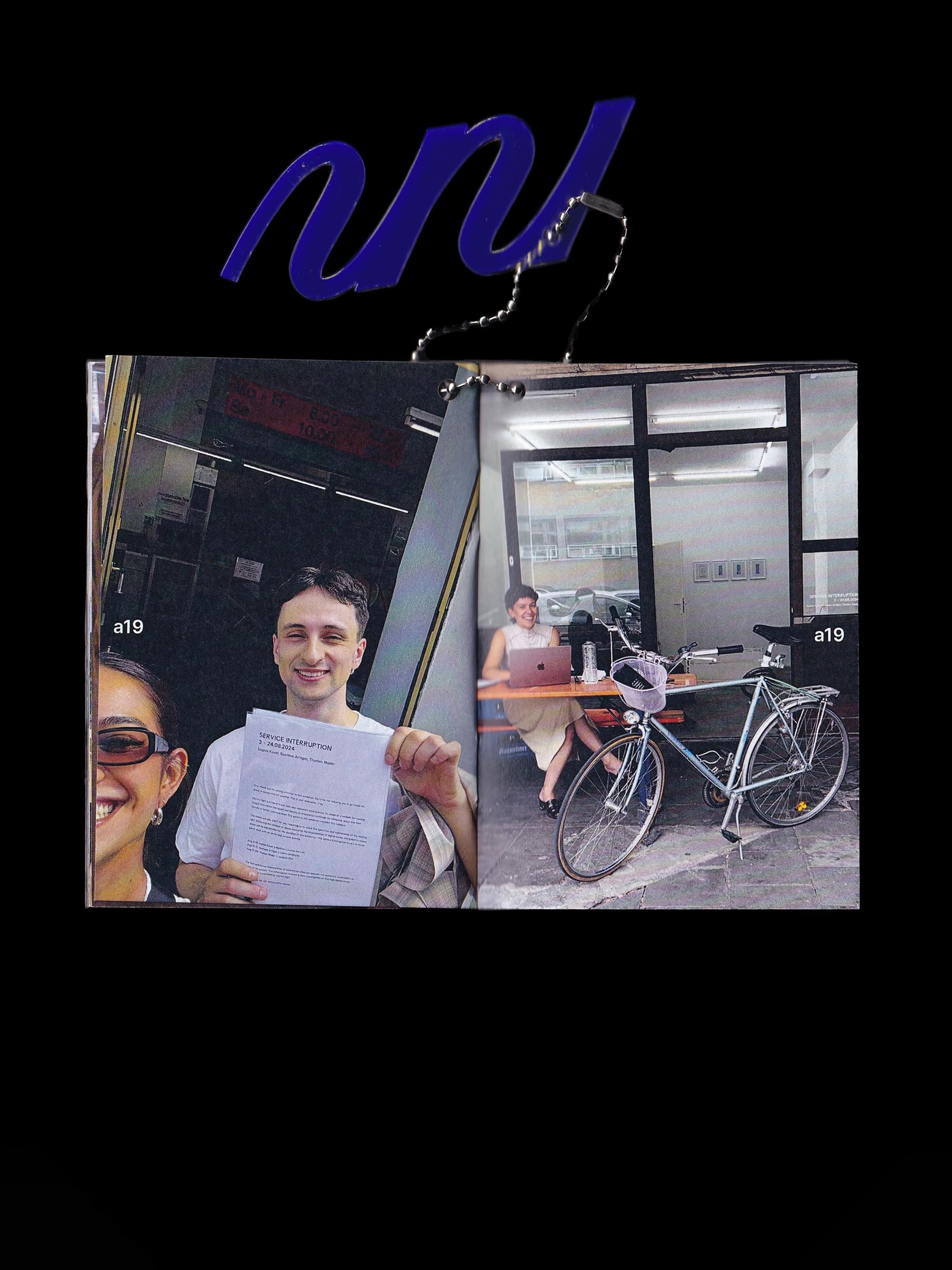 Open making-of booklet with snapshots of the team outside the gallery