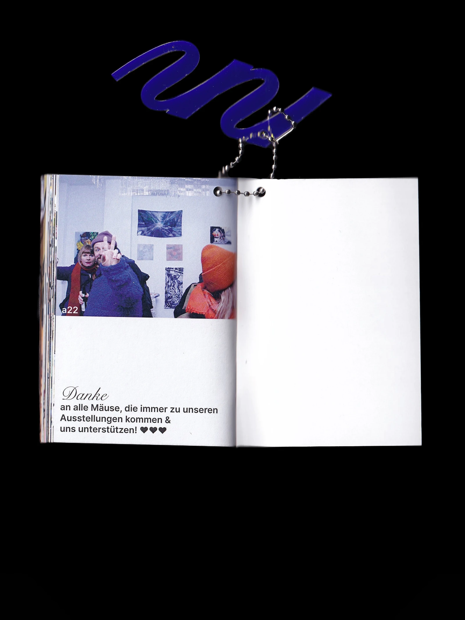 Open making-of booklet with a thank-you page