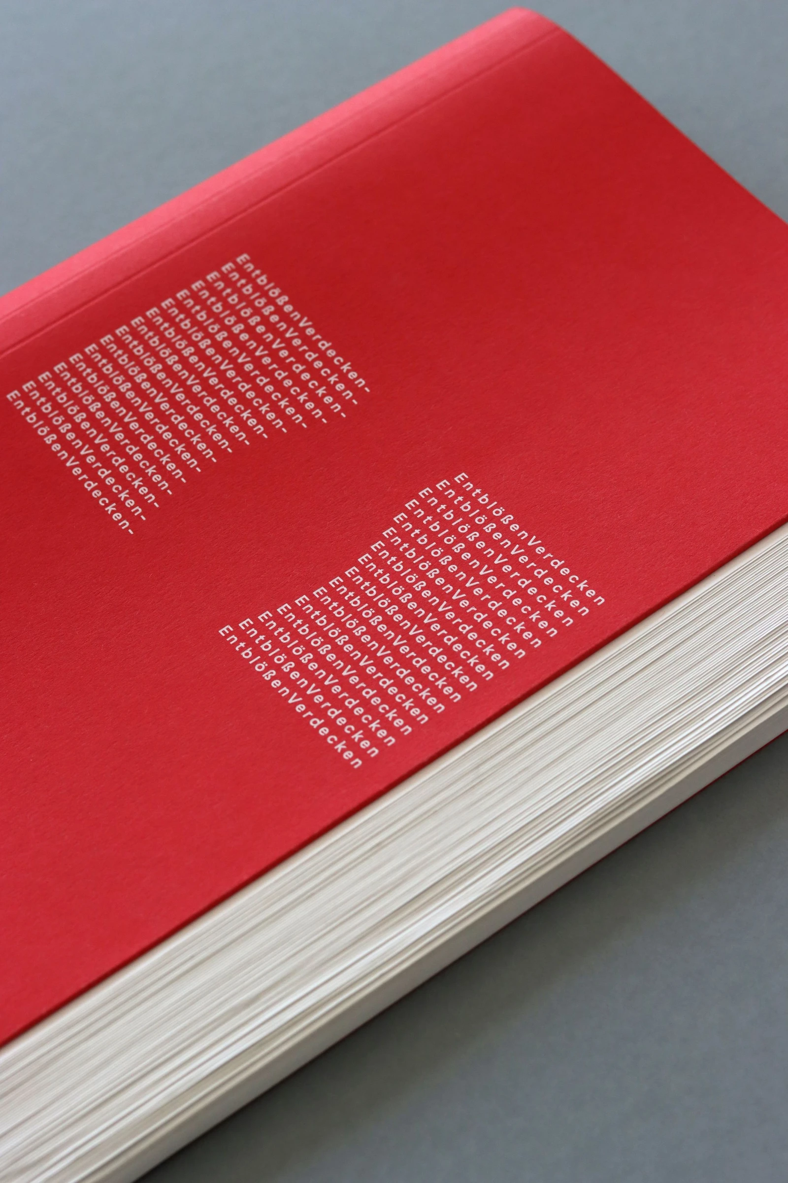 Red book cover with white text set in the shape of a curvy body