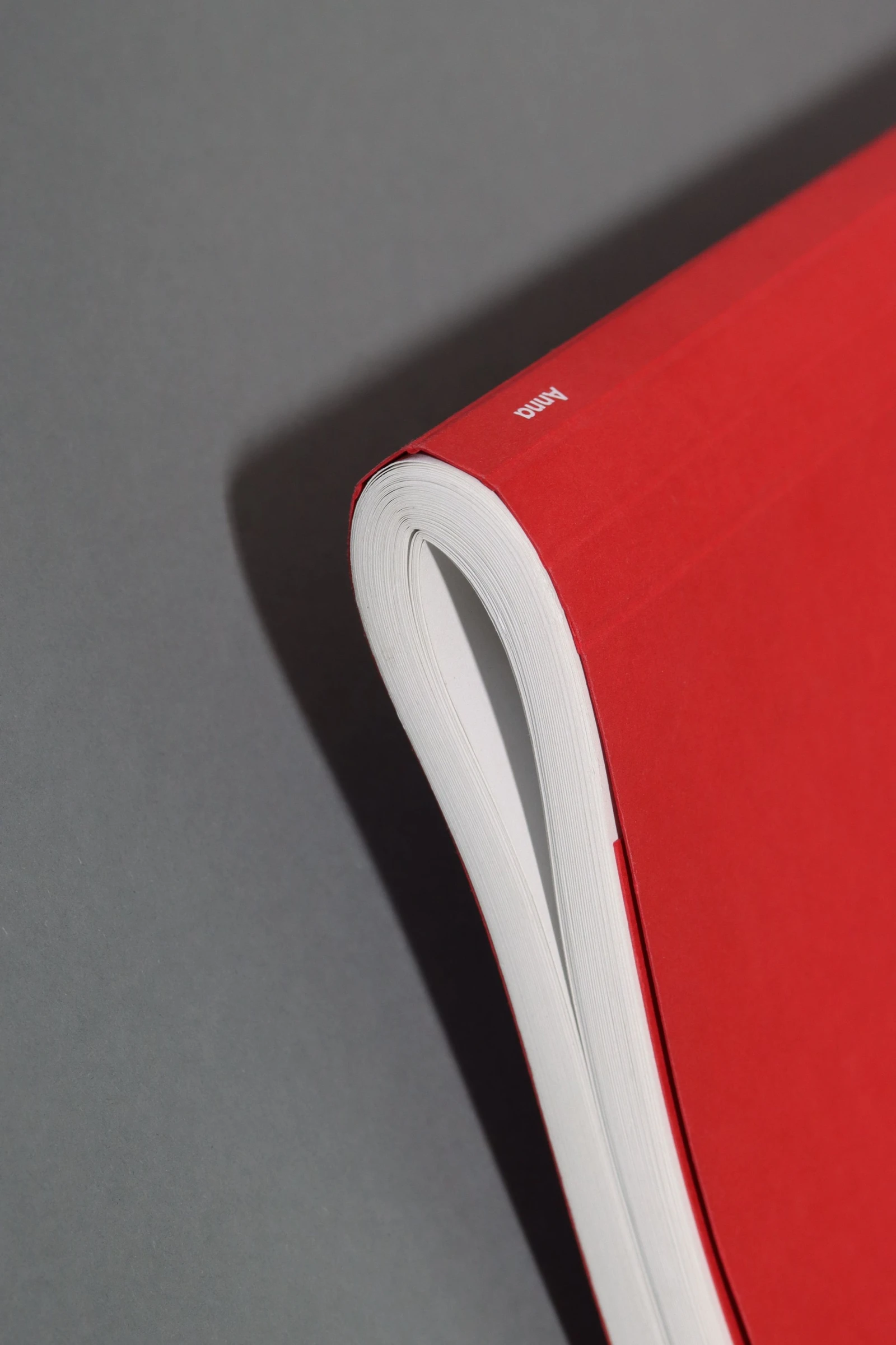 Red book with its soft cover bent back