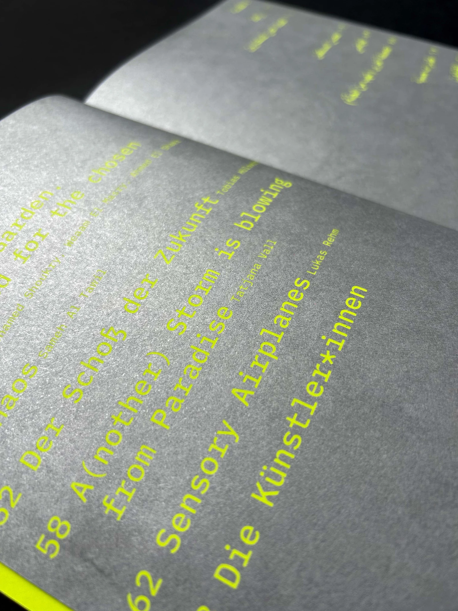 Open catalog with a neon yellow table of contents in monospaced type