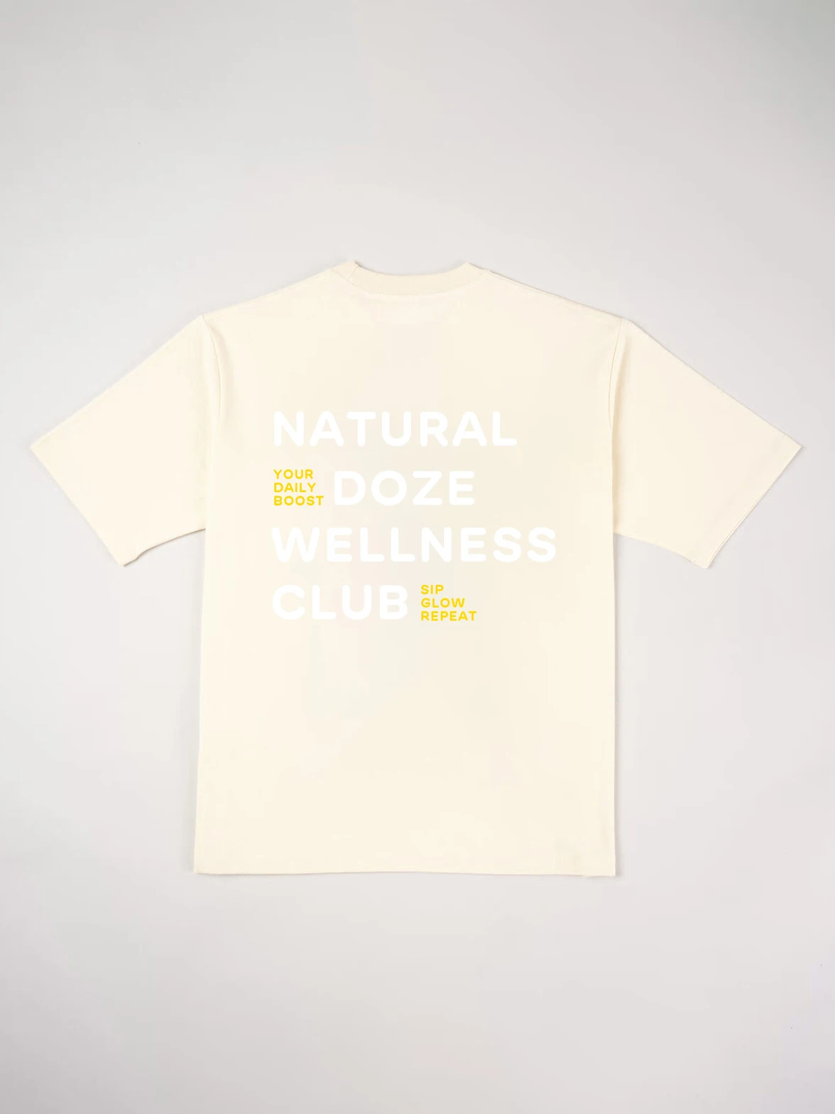 Cream T-shirt printed with "Natural Doze Wellness Club" on the back