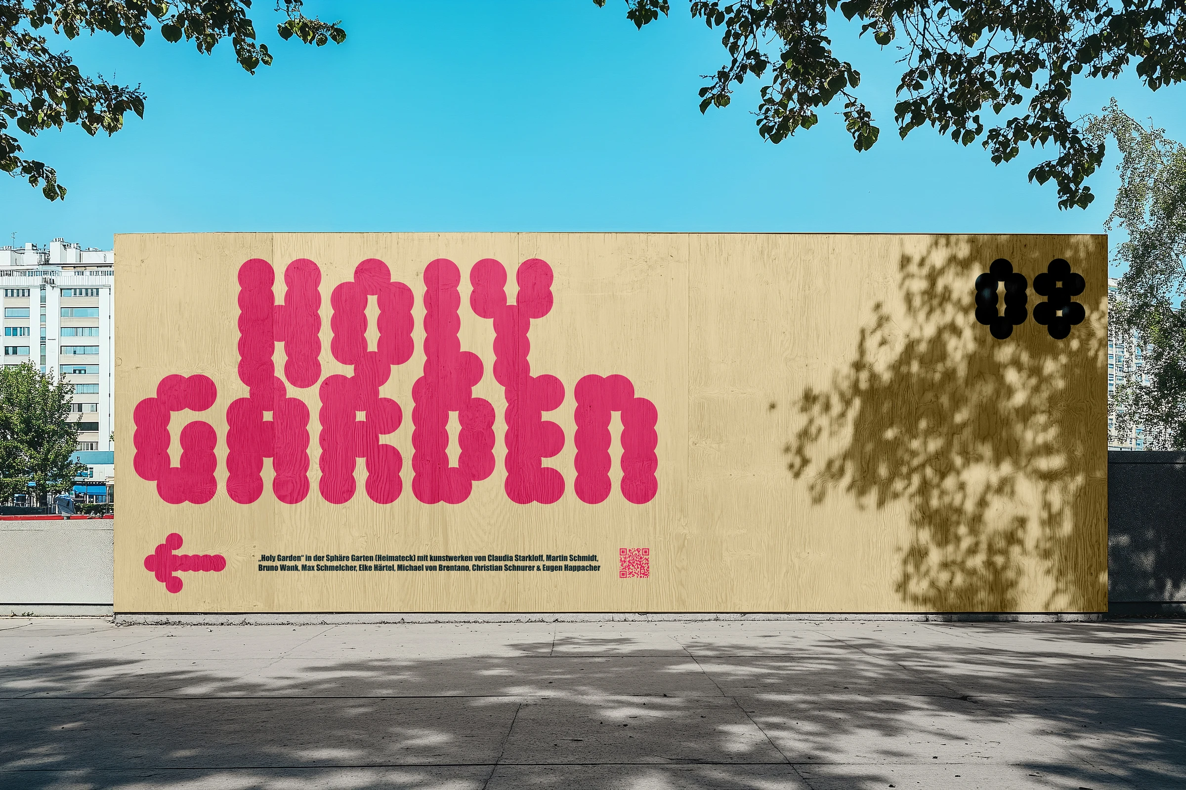 Pink Holy Garden lettering with an arrow on a large wooden signage wall