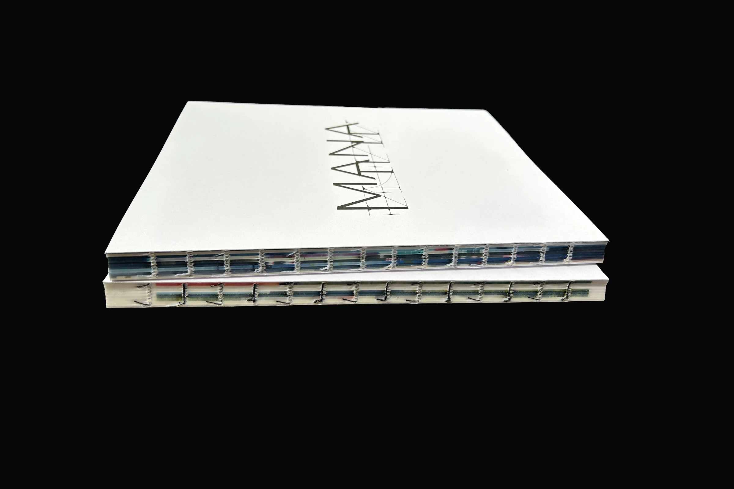 MANA catalog seen from the side, showing its open thread binding