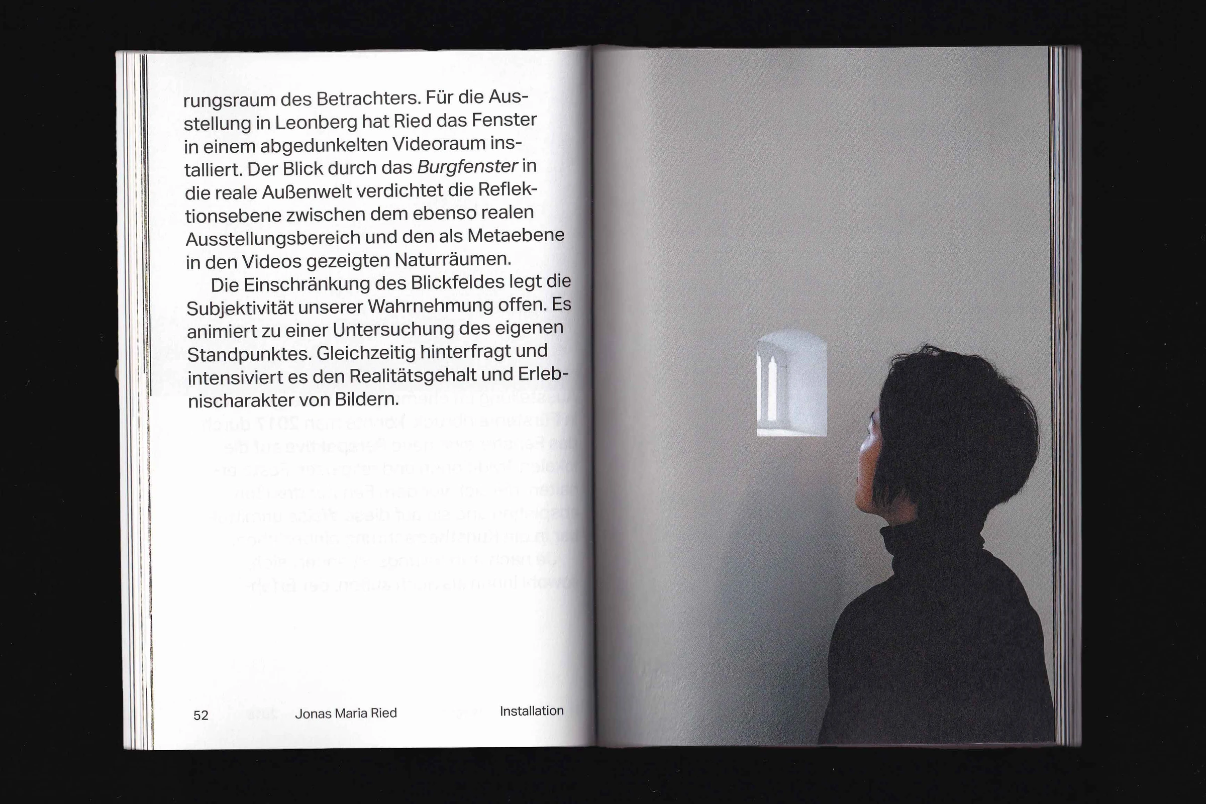 Spread with text and a photo of a person looking at a small lit window